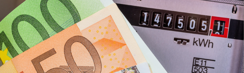 Electricity dial meter with reading and 50 and 100 euro notes in front