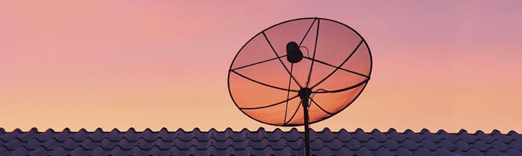 Satellite dish on top of a house to provide satellite broadband