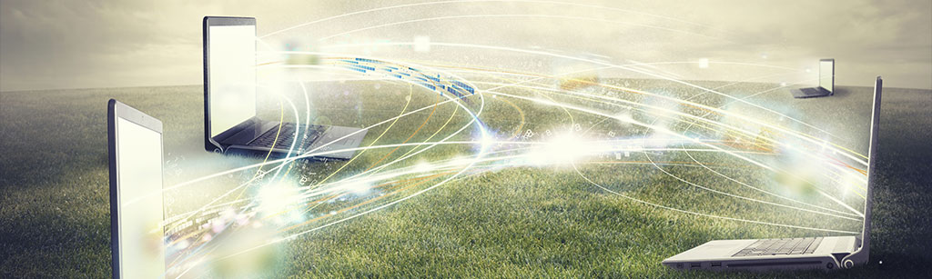 Three laptops with fibre broadband connections between them