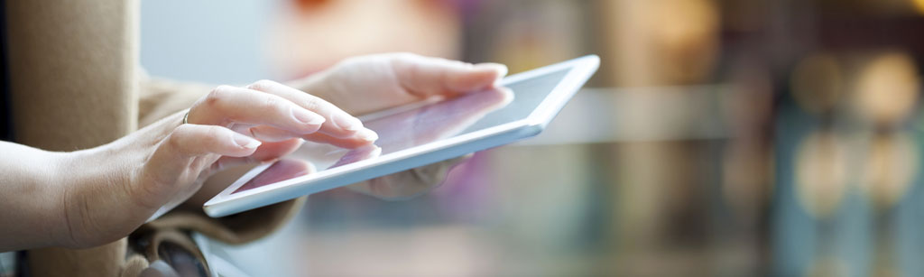 Person scrolling on an ipad tablet