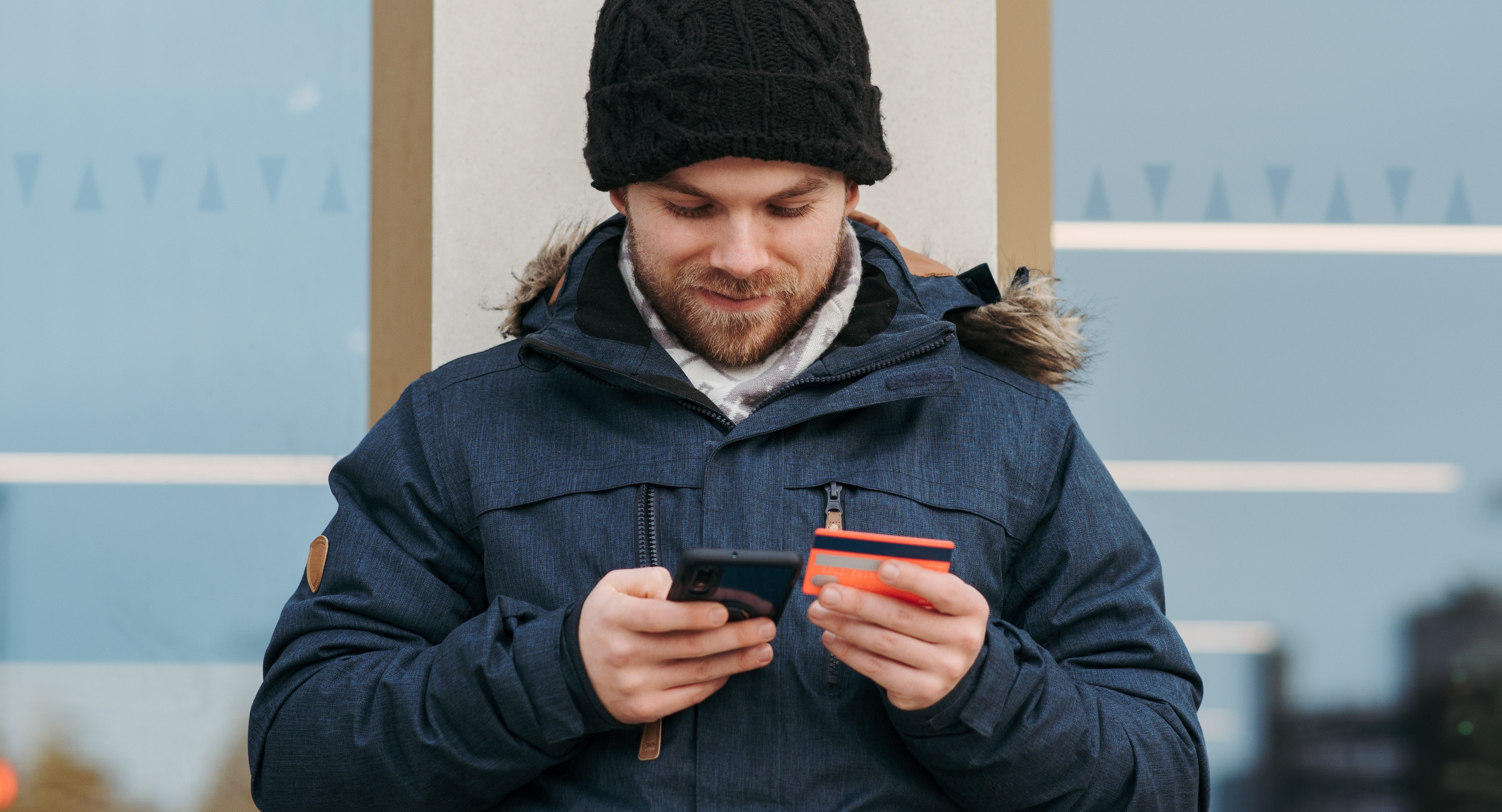 man with credit card and phone