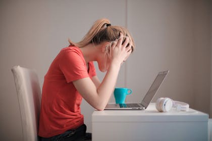 woman stressed at laptop