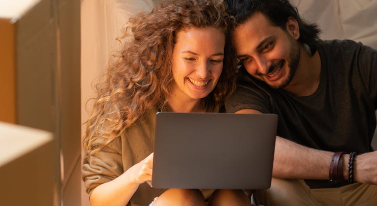 mortgages cosy couple on laptop